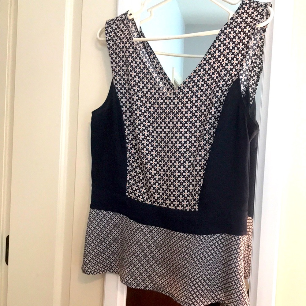 V front and V back shell/ tank. Slightly fitted wit fit and flare peplum